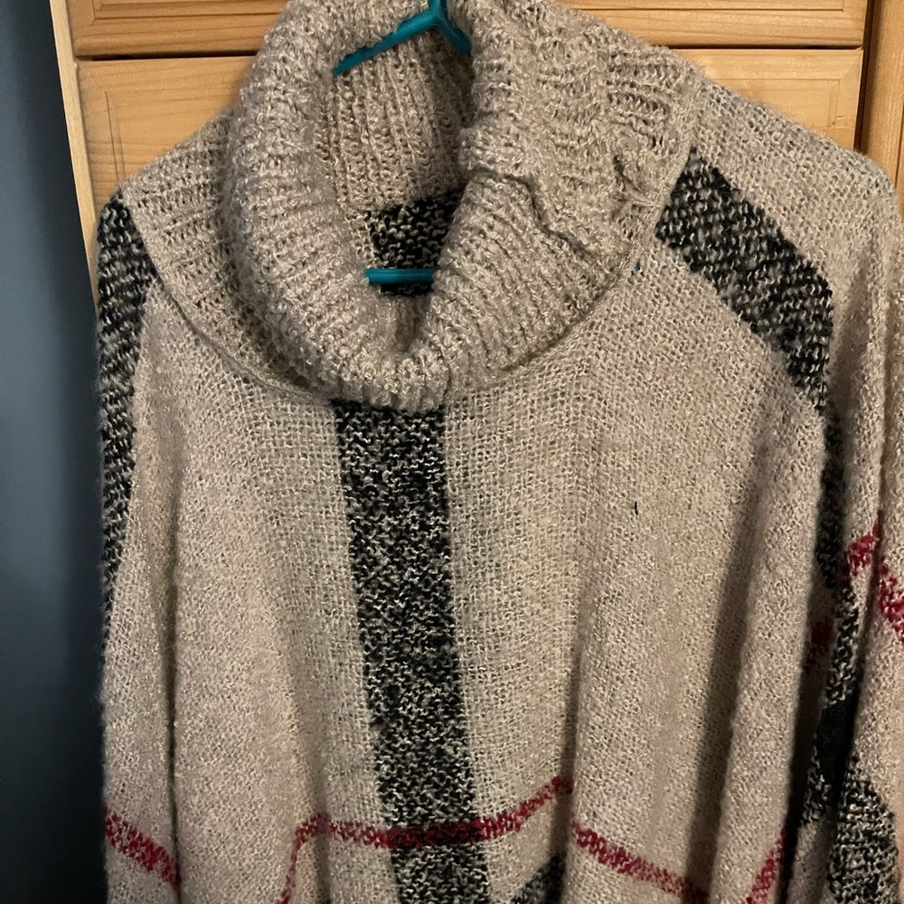 One size Sweater poncho from the Snooki Shop.  Worn once.